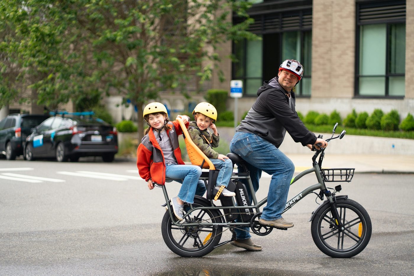 Family-oriented cargo or utility e-bike in use