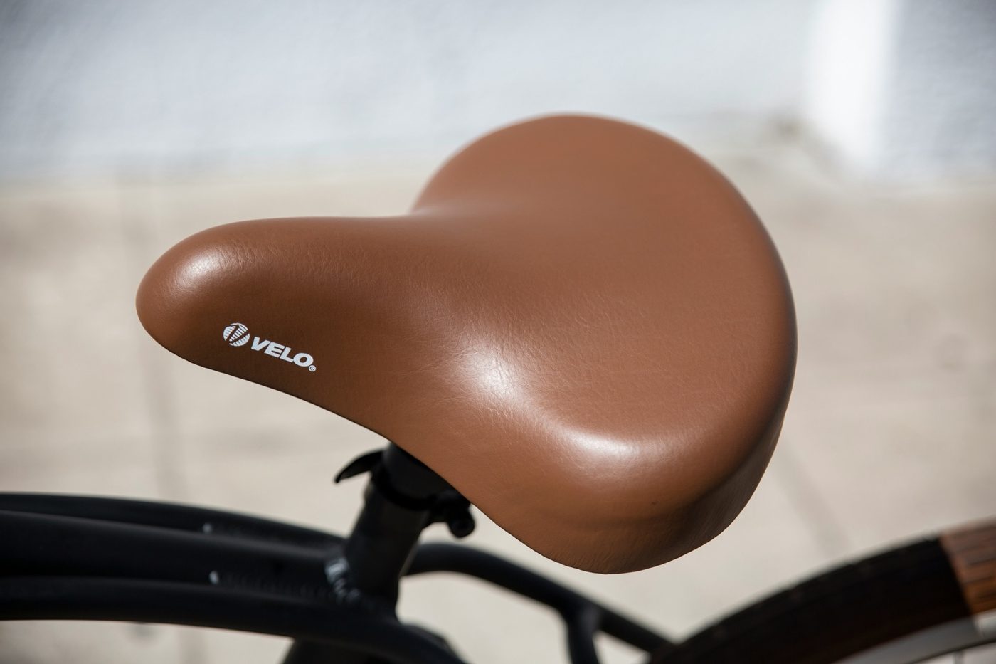 Comfort-oriented saddle close-up on a cruiser-style e-bike